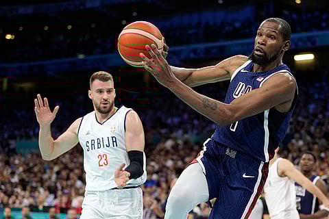 Kevin Durant of United States passes the ball against Serbia
